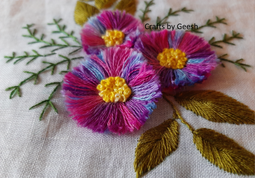 Fluffy textured flower embroidered using turkey stitch